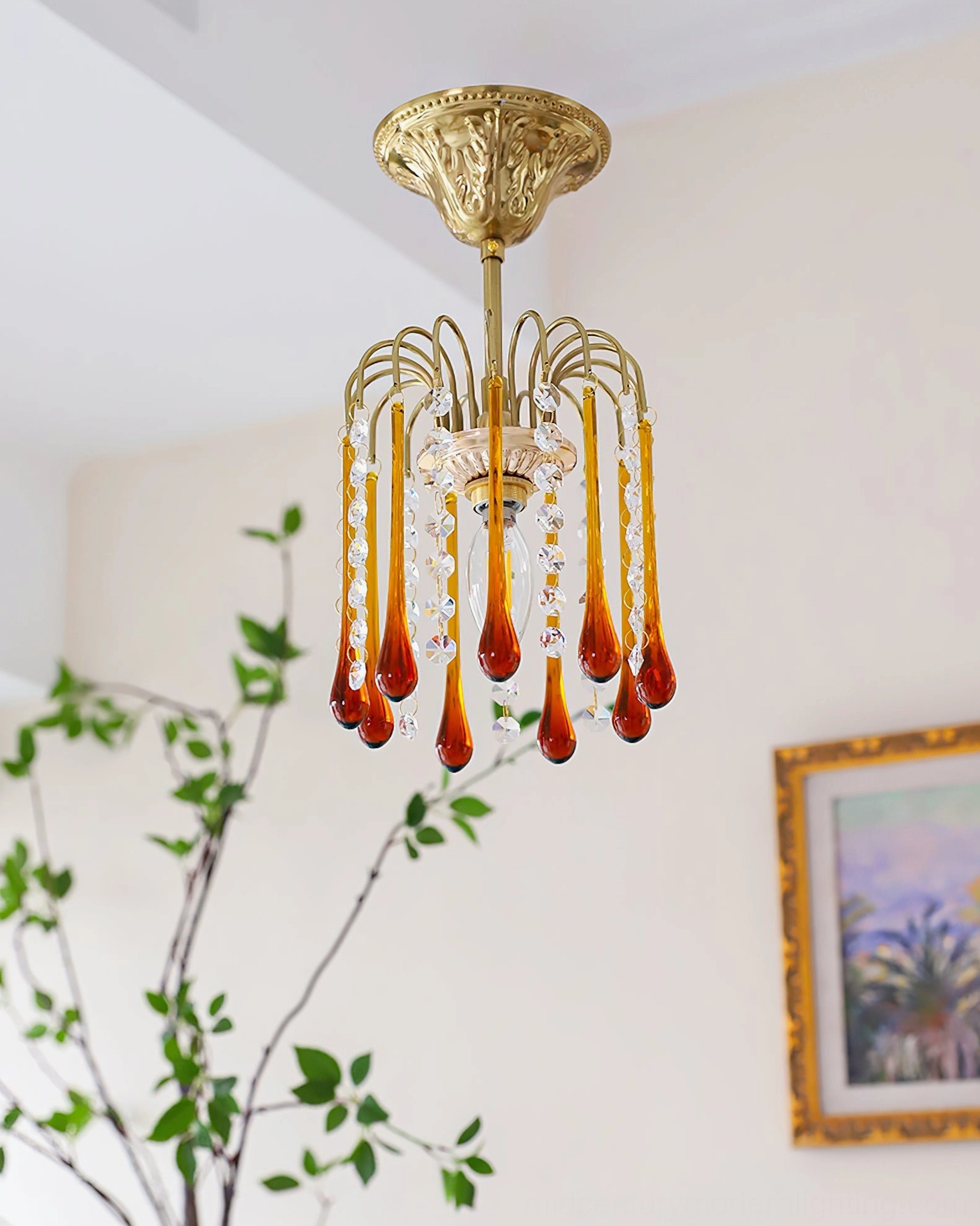Three-quarter front perspective of Maltose gold brass ceiling light with minimal amber and clear crystal pendants in home setting