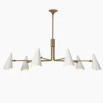 Mancini mid-century modern chandelier with eight white cone shades and brass arms on white background, overhead view