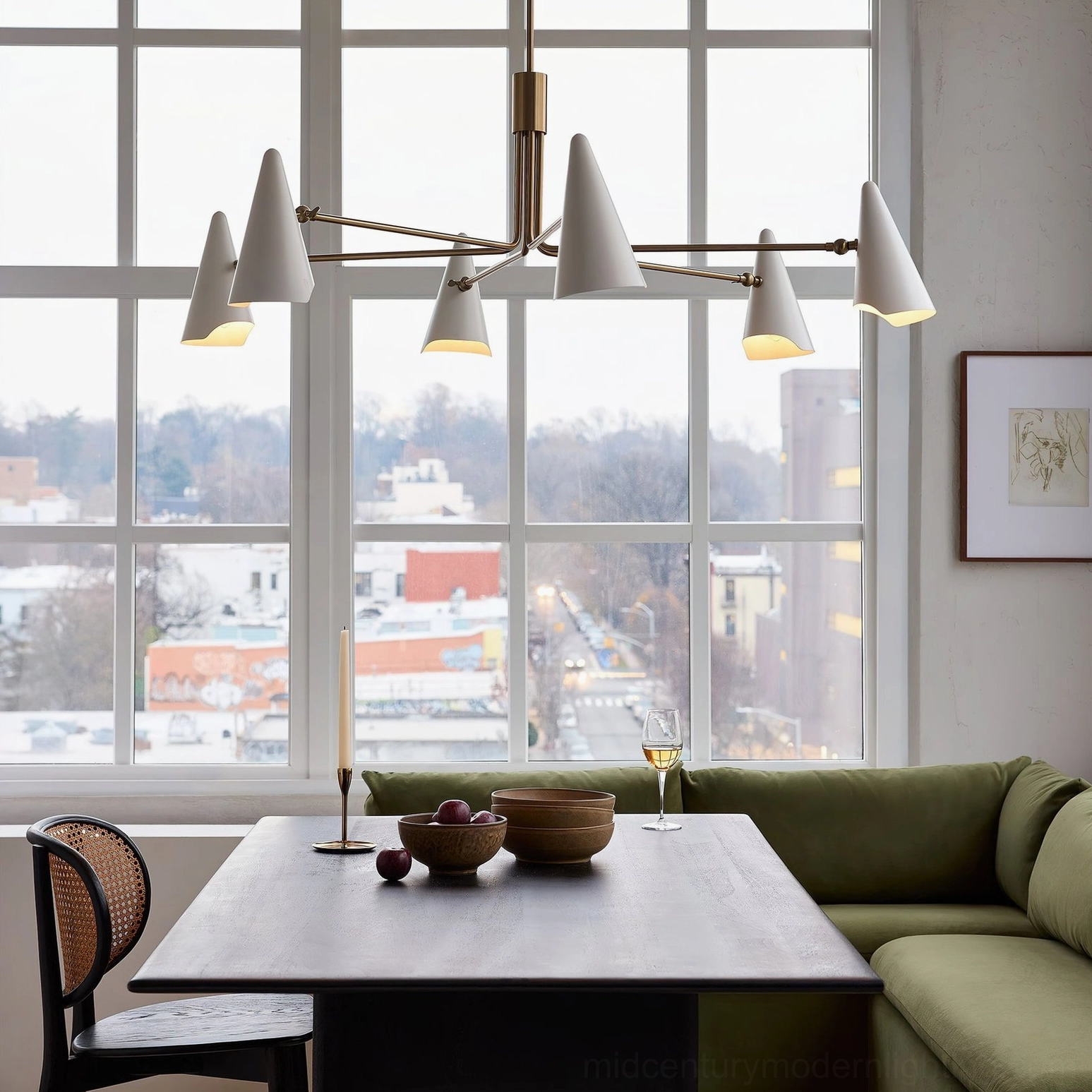 Mancini mid-century modern chandelier side view in contemporary dining room with large window