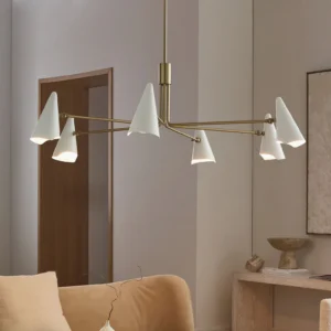 Mancini chandelier installed in warm minimalist living room with neutral furnishings and natural light