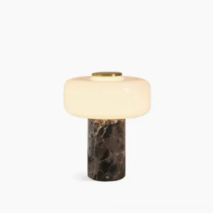 Marble cylinder table lamp with frosted glass diffuser, front flat studio view showing dark veined marble base and brass top accent