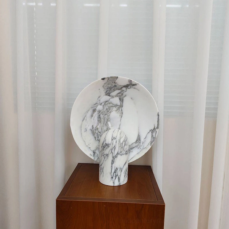 Marble table lamp base construction detail showing cylindrical marble form and structural integrity supporting round diffuser panel