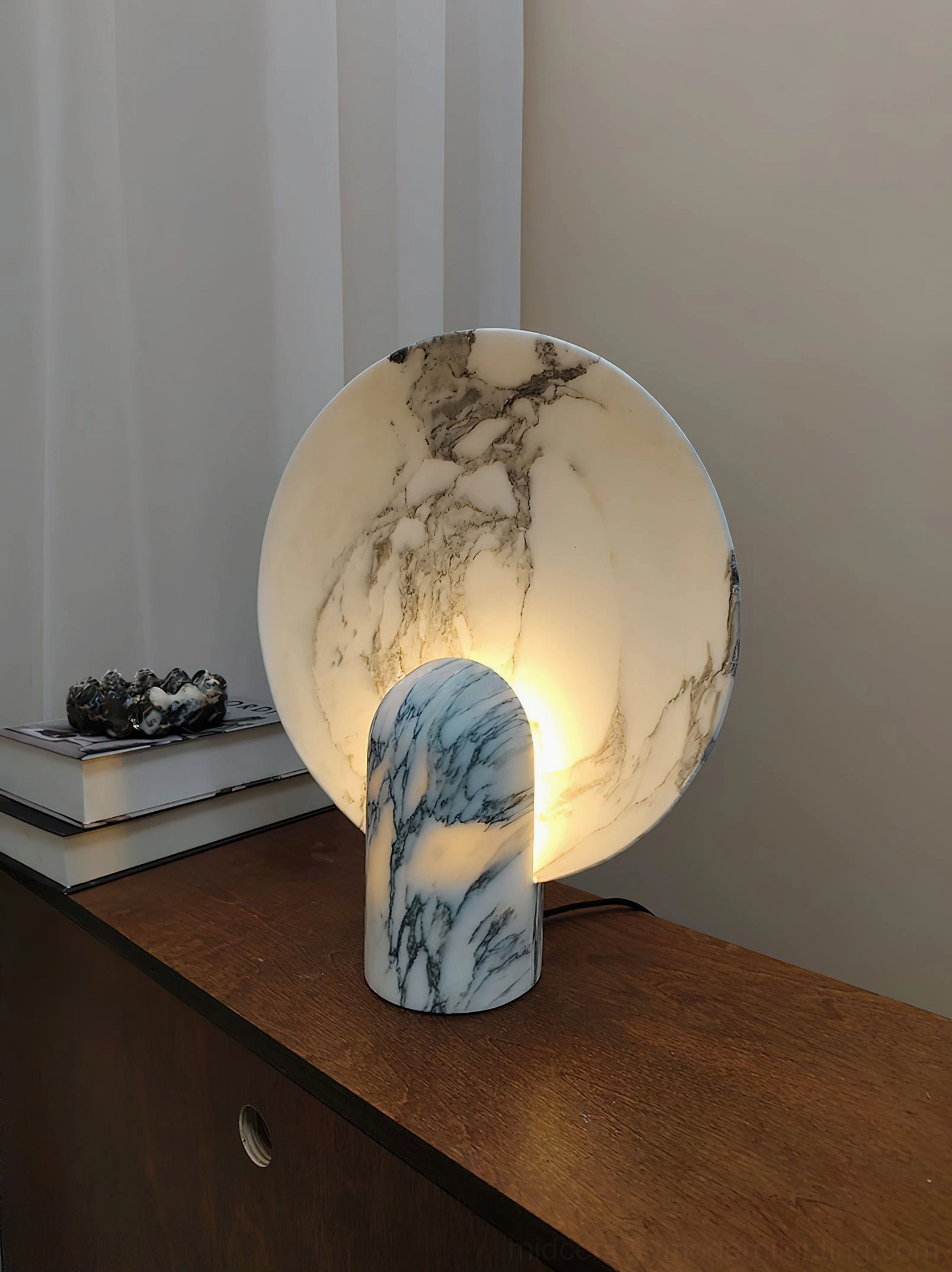 Marble table lamp styled in bedroom setting creating intimate pre-sleep ritual comfort with soft warm illumination