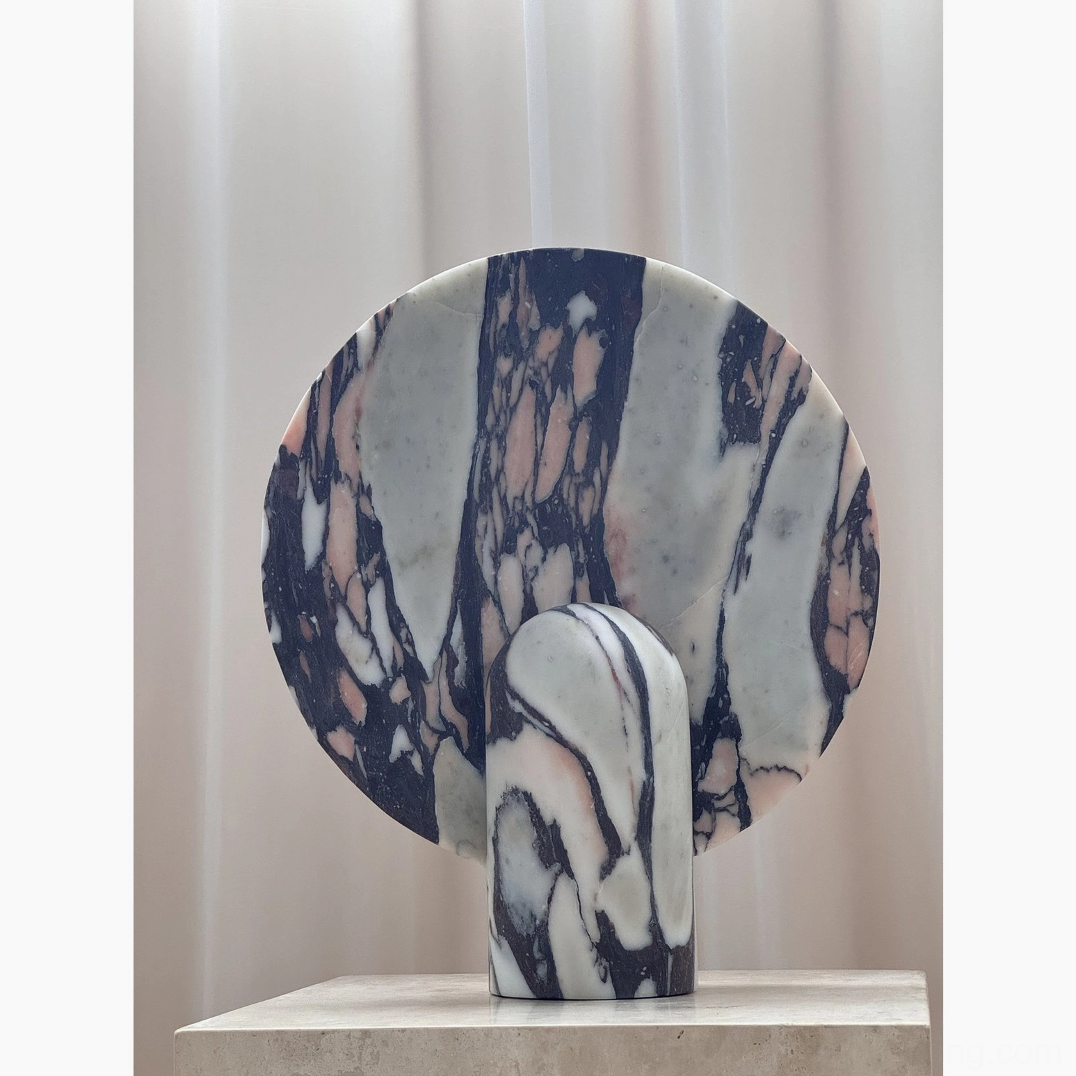 Marble table lamp positioned as bedside accent creating soft warm light source for bedroom sanctuary and relaxation space