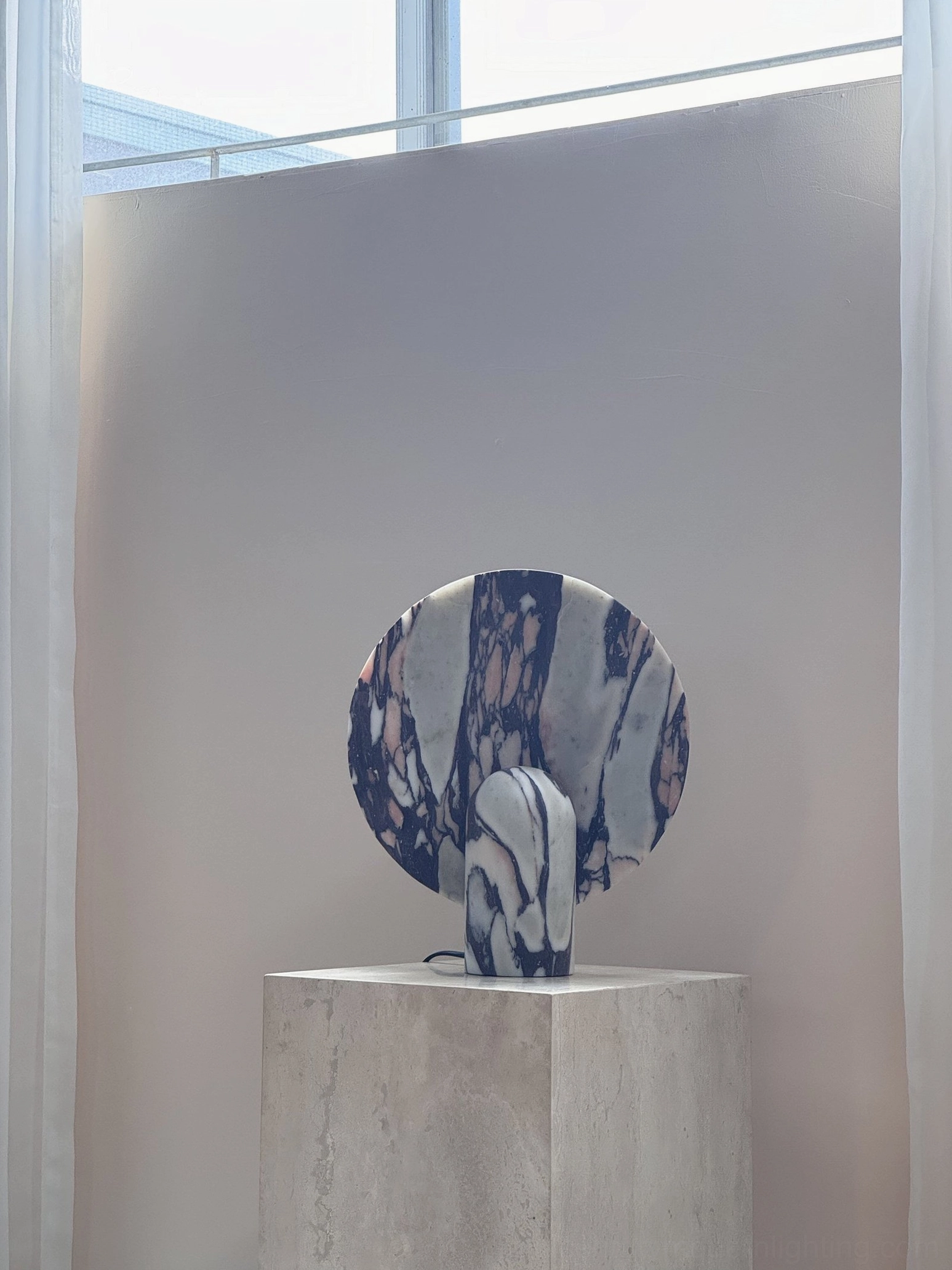 Elegant marble table lamp as console table focal point emphasizing contemporary luxury and sophisticated minimalist design language