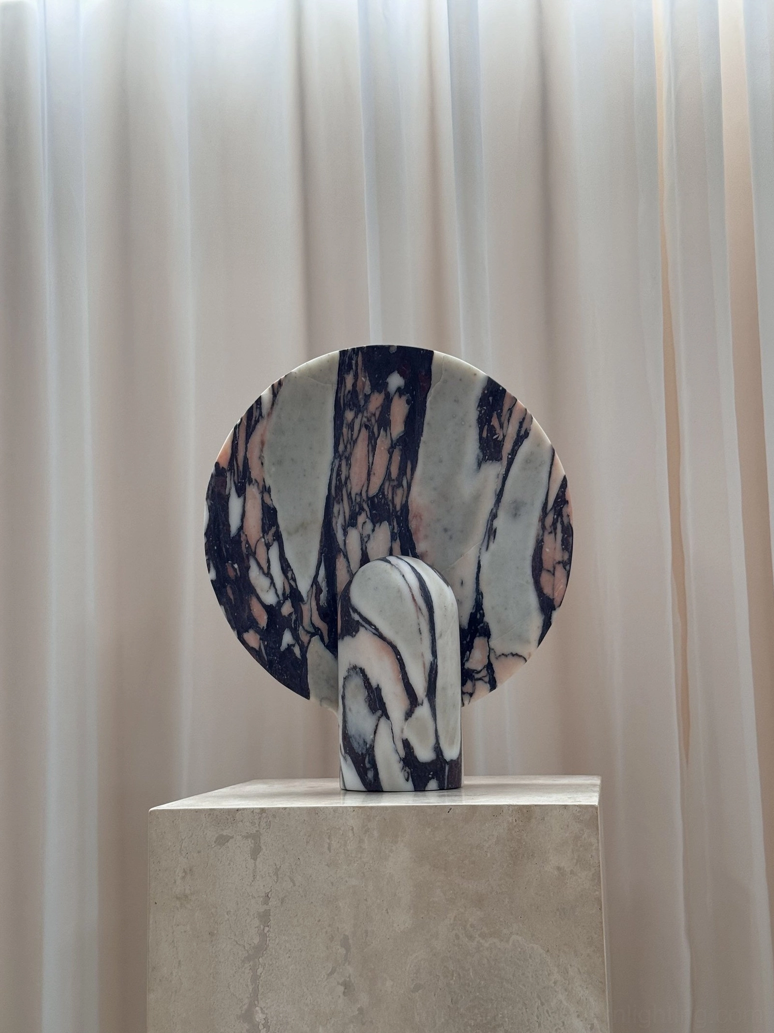 Marble table lamp in designer interior setting as conversation piece communicating design literacy and modernist appreciation