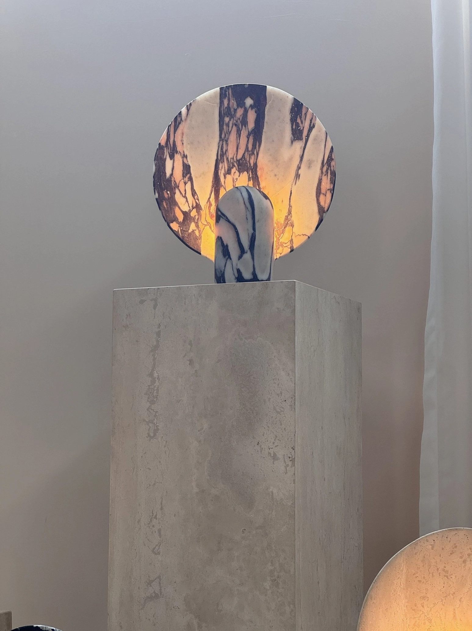 Marble table lamp positioned in minimalist home office demonstrating productivity enhancement with sophisticated aesthetic appeal