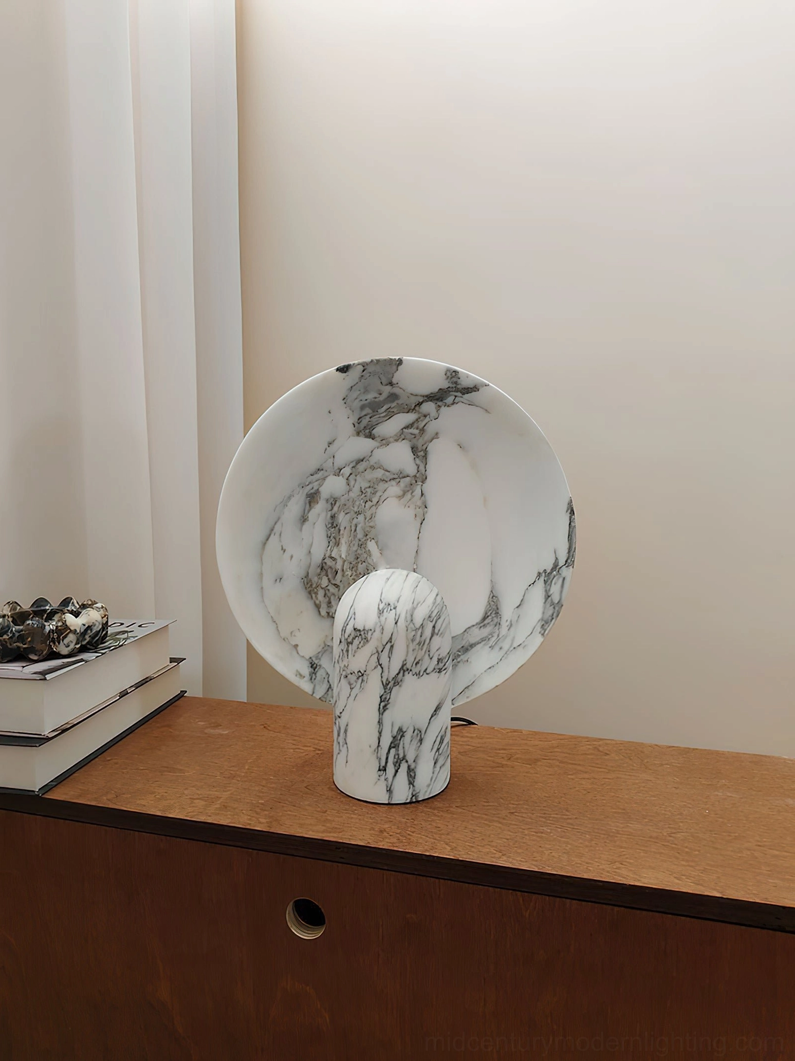 Marble table lamp in living room console arrangement as sculptural statement piece reflecting design sophistication