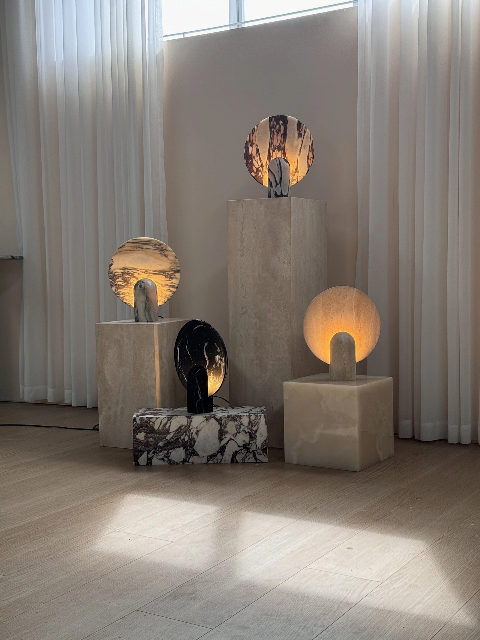 Detail view of marble table lamp shade showing natural veining patterns and light diffusion characteristics of premium stone material