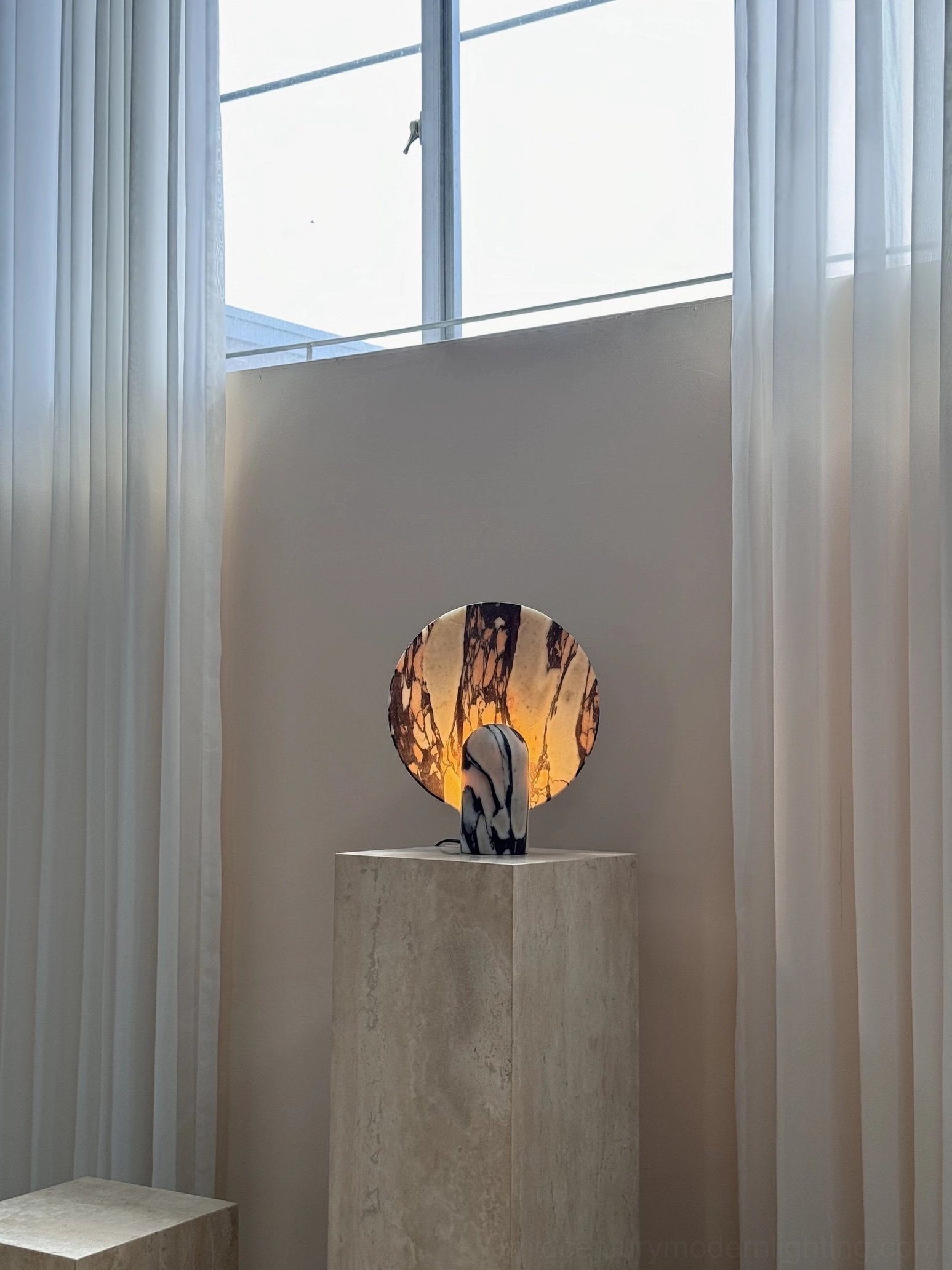 Modern marble table lamp on workspace surface showing integrated LED providing focused illumination for contemporary office design