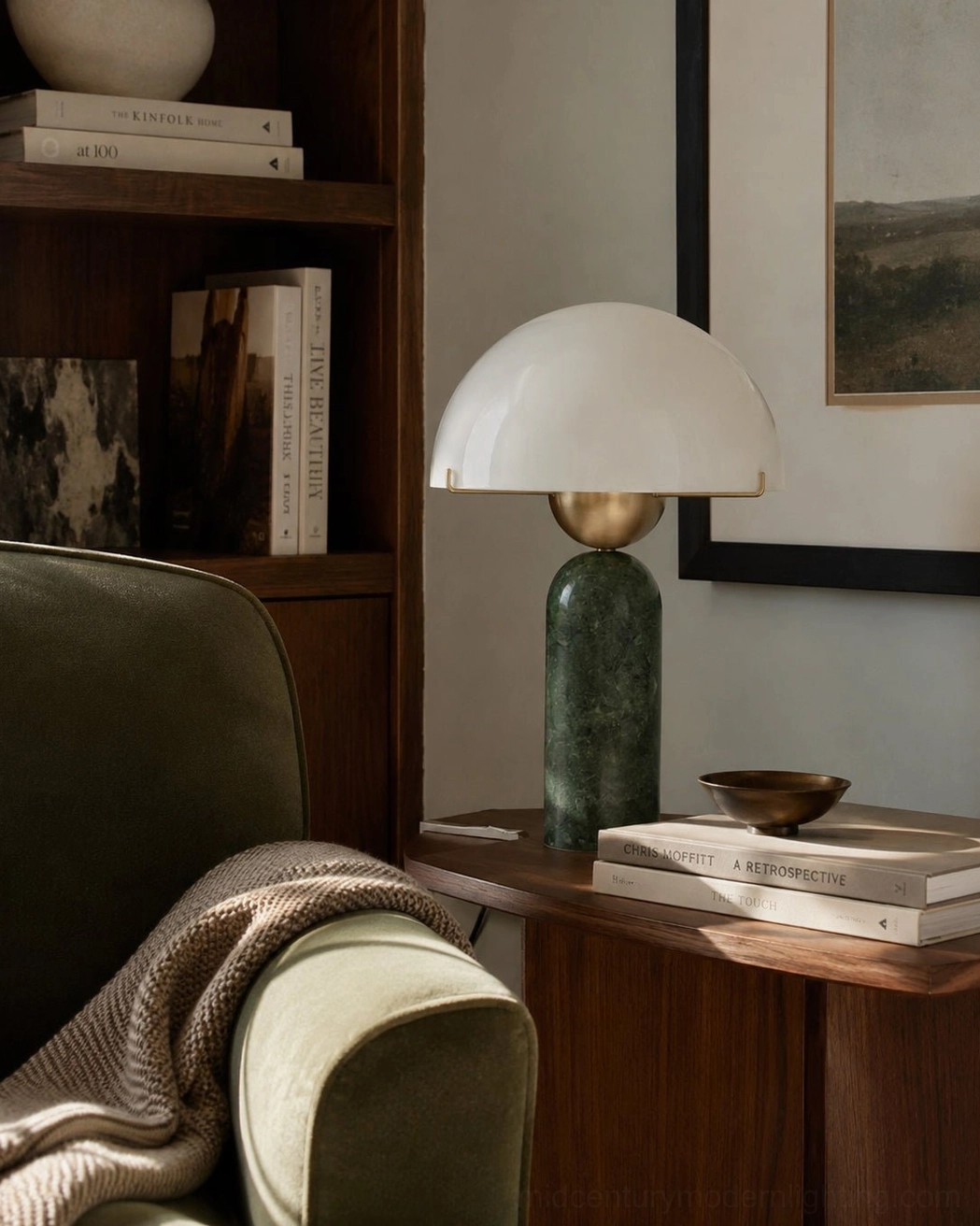 Natural marble table lamp with brass hardware on home bookshelf side table, styled with books and decorative objects