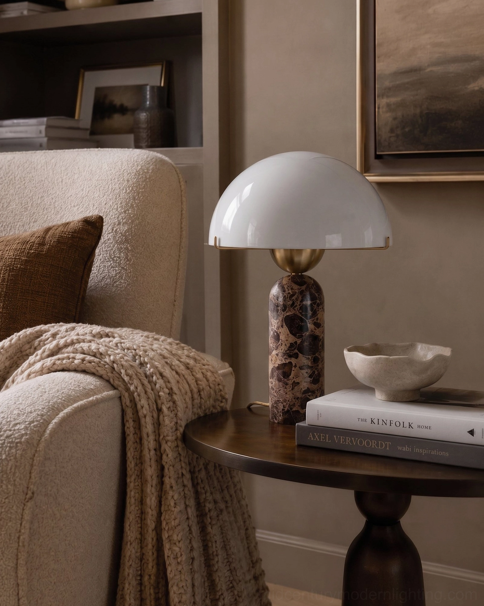 Sculptural marble table lamp with unlit frosted glass dome shade, side three-quarter view highlighting natural marble veining