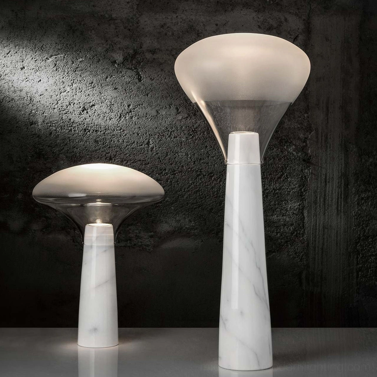 Two white marble table lamps with clear glass diffusers, luxury minimalist design, interior styling
