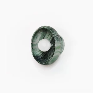 Marble wall lamp with dark green veining on white background, oblique front view showcasing natural stone texture and round fixture