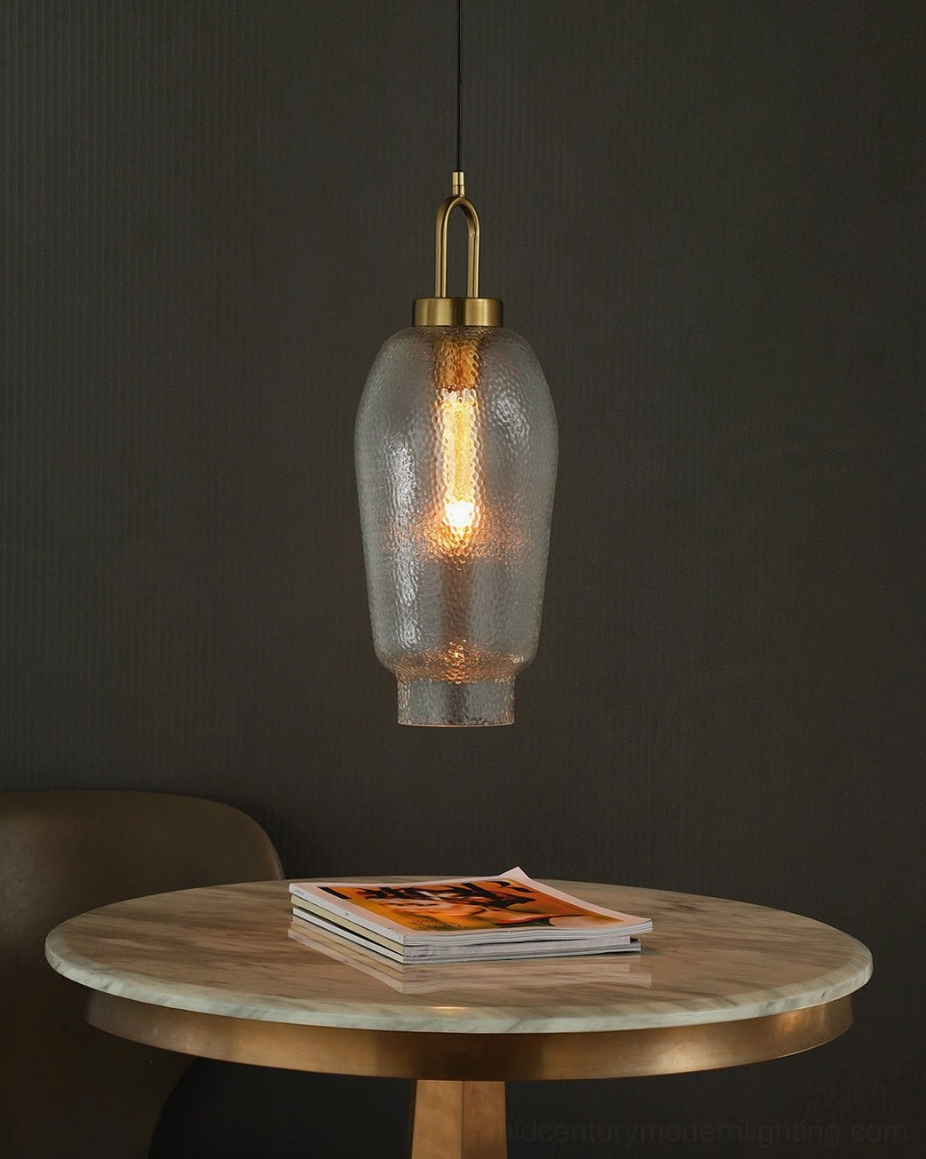 Marco textured glass pendant with brass fittings in minimalist modern home décor showing ambient lighting effect
