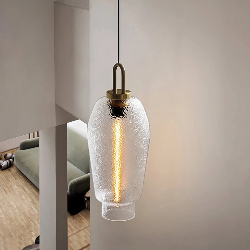 Tall barrel Marco textured glass pendant with exposed filament bulb and brass fixtures in modern living room