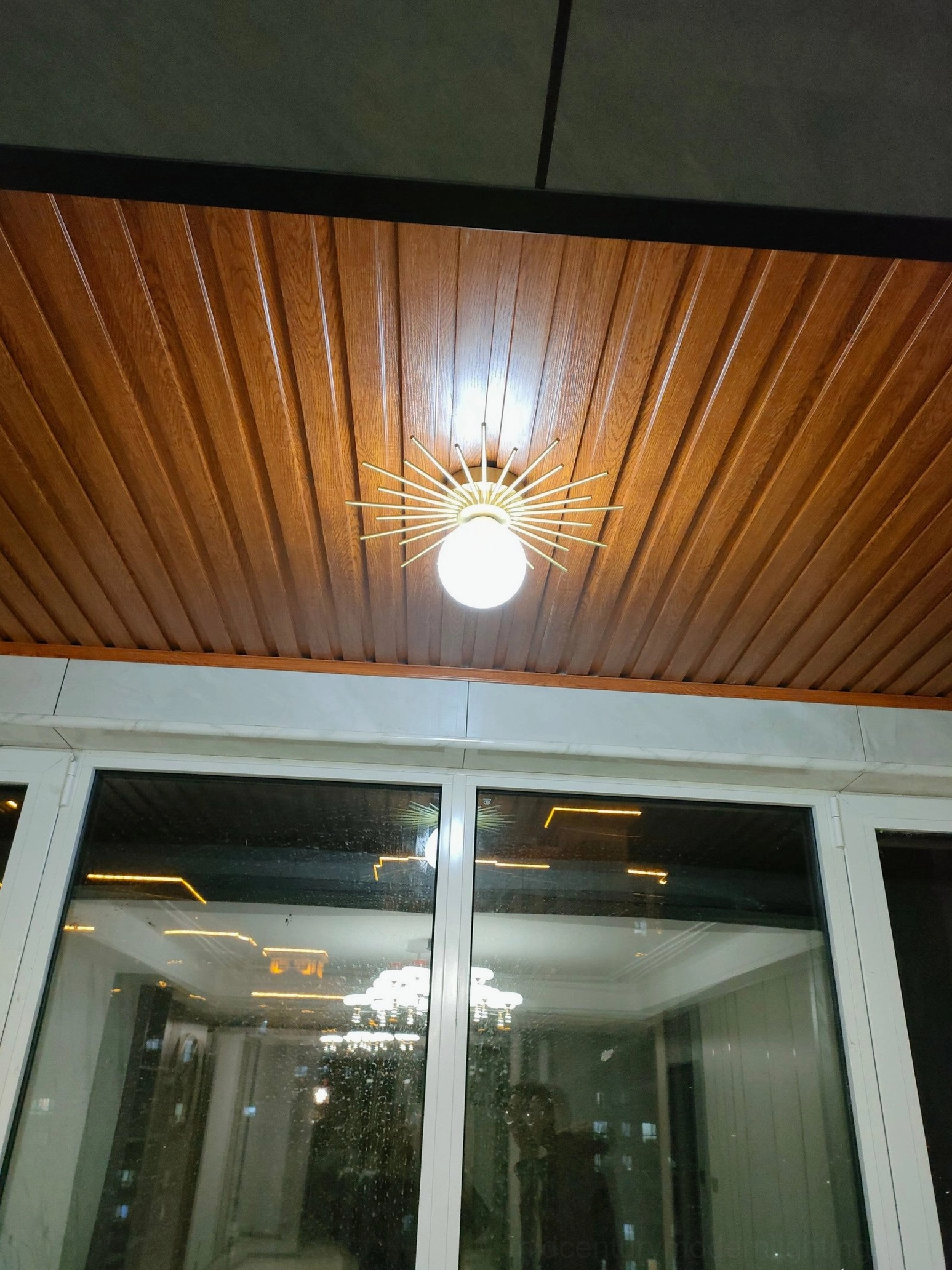 Margaret starburst ceiling light radial design detail, brass rod structure mid-century modern construction