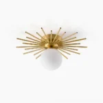 Margaret starburst ceiling light with brushed brass radial rods and frosted glass globe, mid-century modern flush mount fixture frontal view