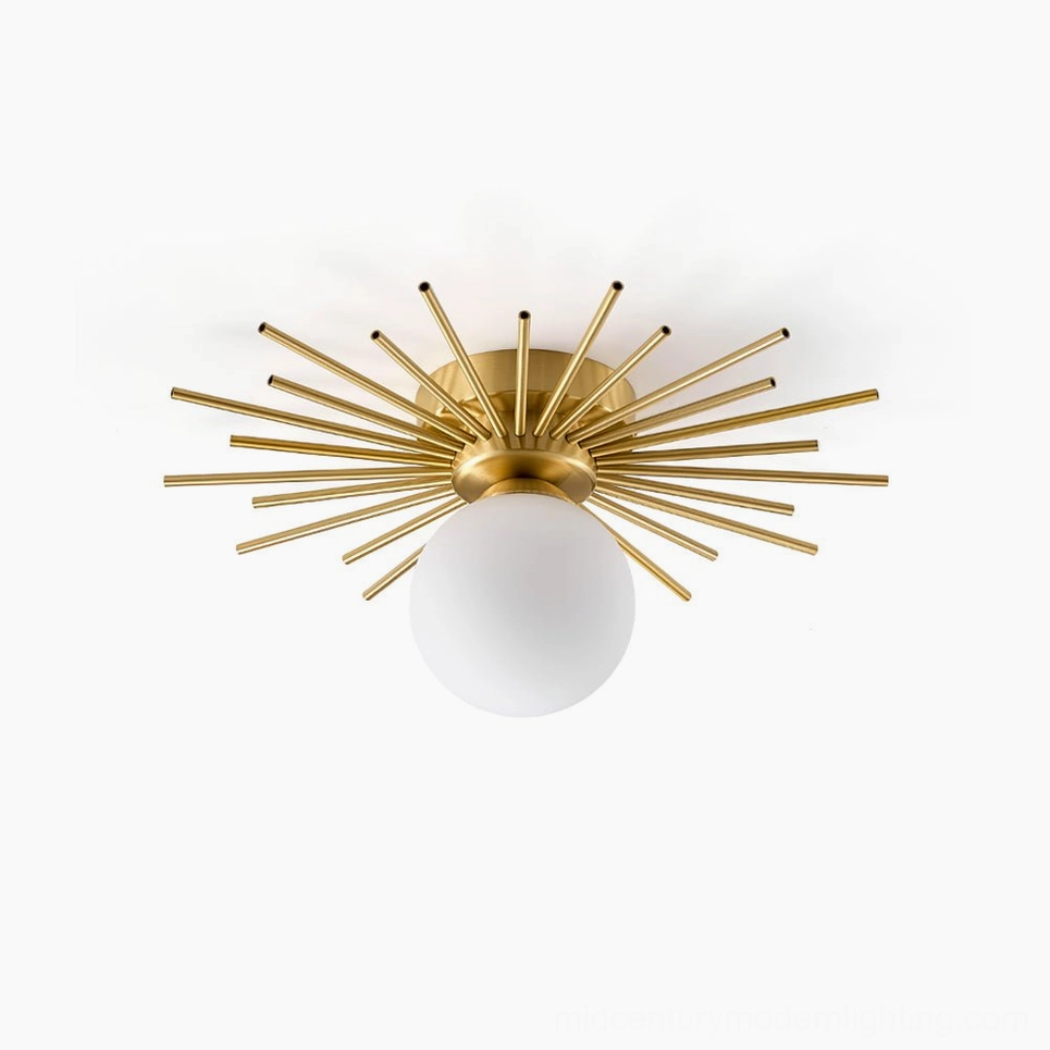 Margaret starburst ceiling light with brushed brass radial rods and frosted glass globe, mid-century modern flush mount fixture frontal view