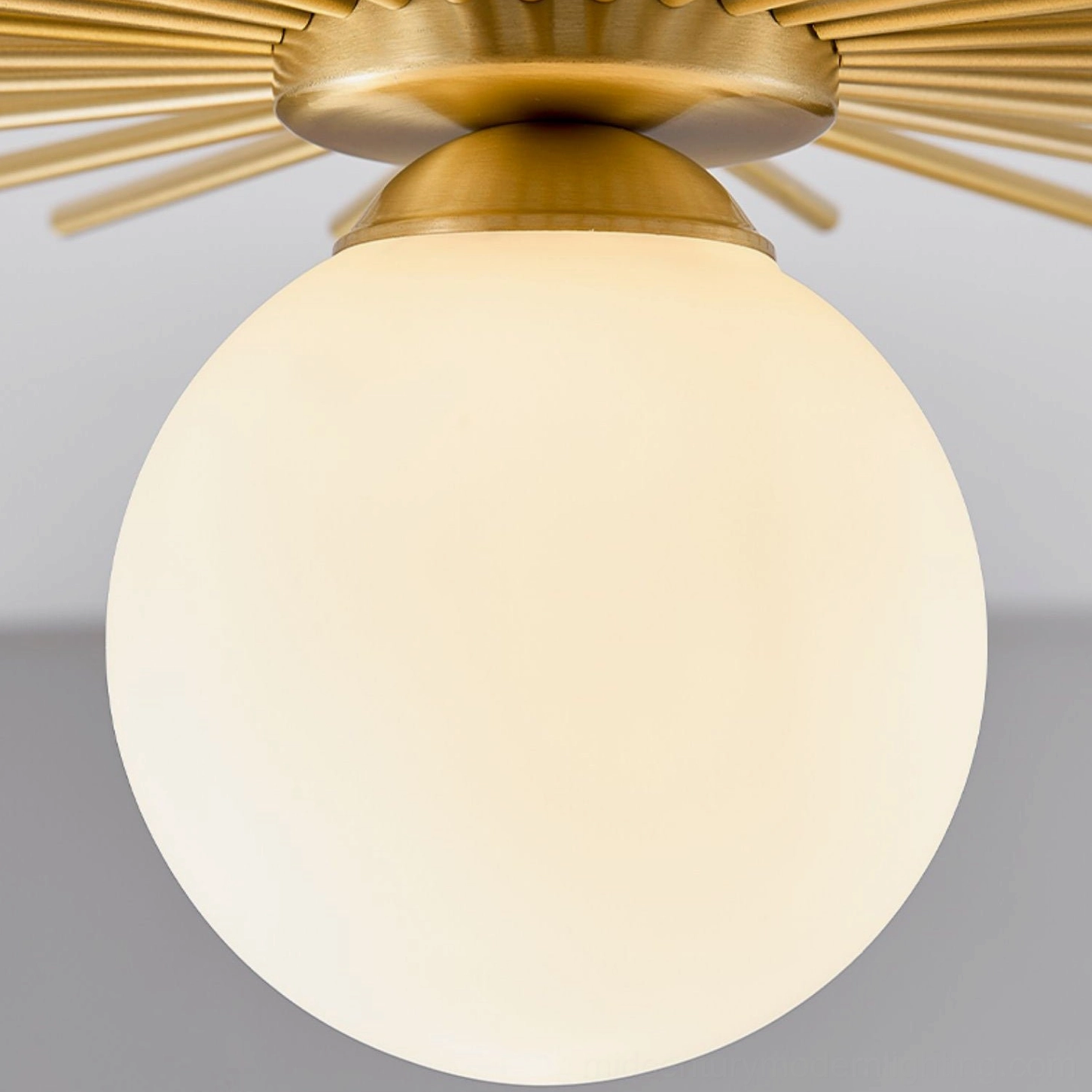 Side view detail of Margaret ceiling lamp large frosted glass globe with brass mounting cap and radial frame