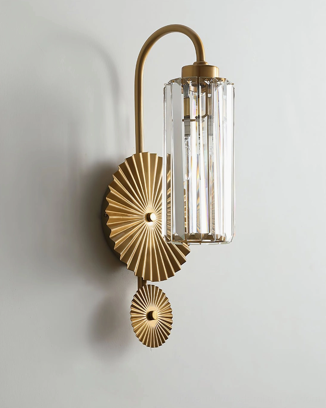 Maria brass sconce side profile revealing two-layer sunburst design and geometric pleated details