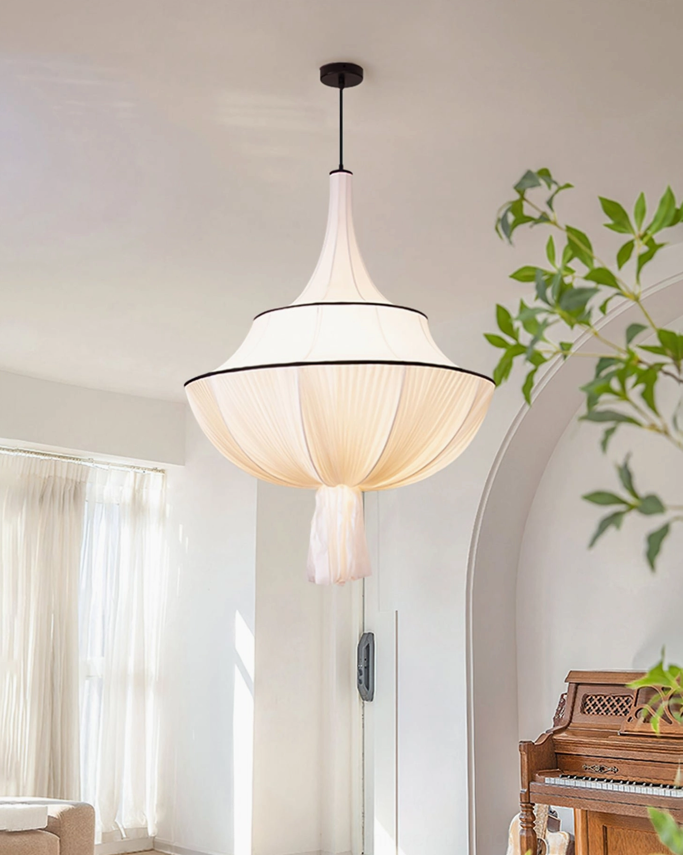 Marianna pendant light with warm neutral fabric shade in vintage living room with arched doorway and piano