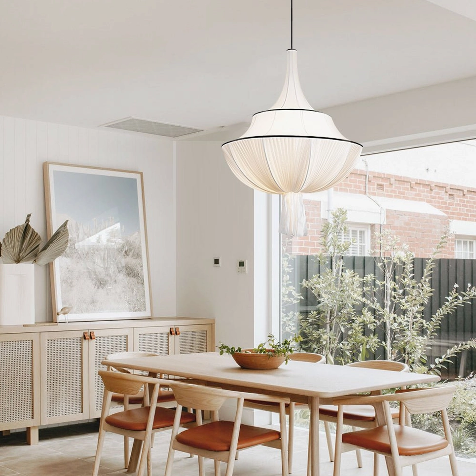 Marianna off-white pleated pendant light with warm glow creating ambient lighting in residential interior