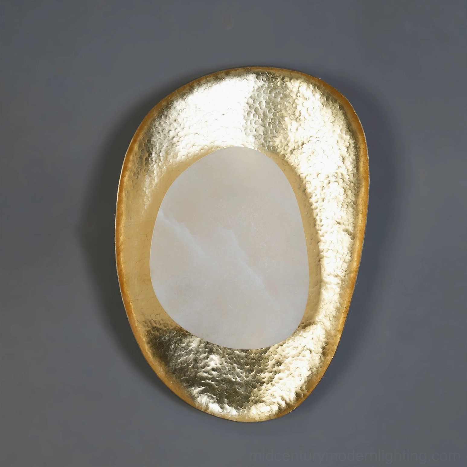 Contemporary brass wall sconce with asymmetrical frame design, premium alabaster stone panel