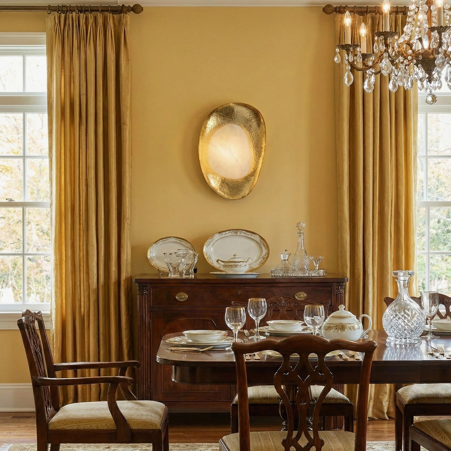 Brass and white alabaster wall sconce installed in traditional luxury dining room, creating warm ambient lighting