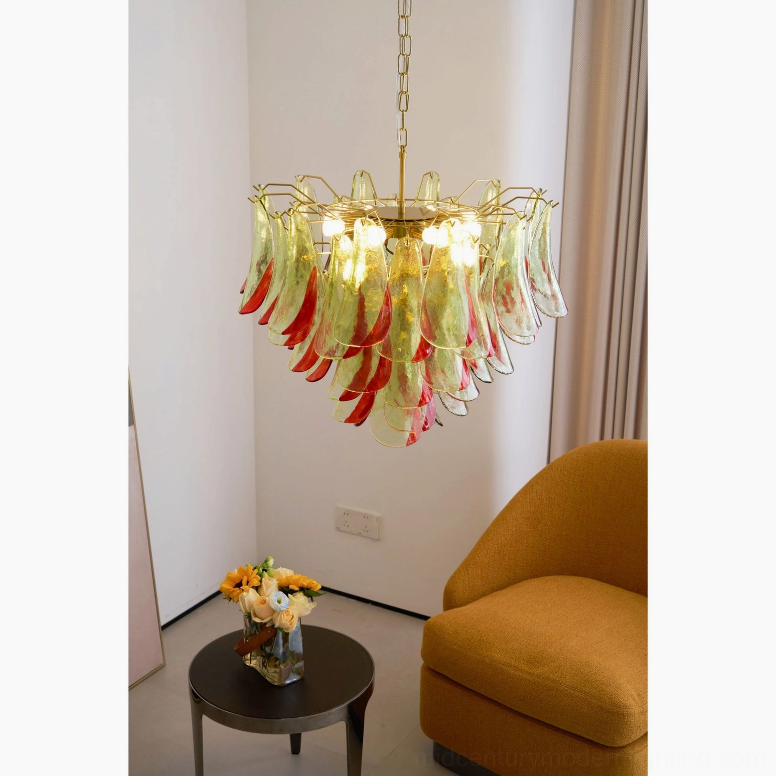 Marielle chandelier showcasing luminous color refraction through layered hand-blown glass elements