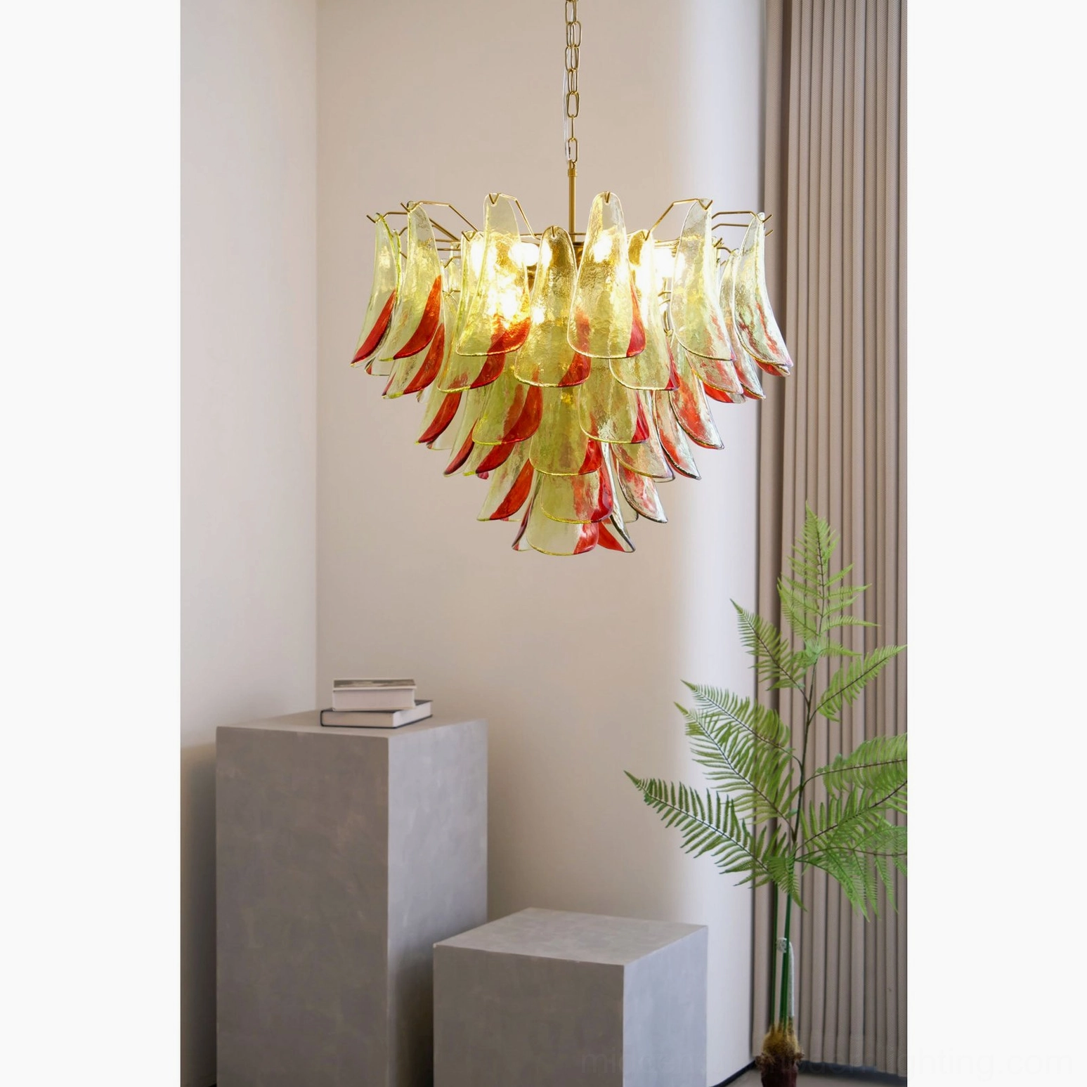 Overhead view of lit Marielle glass chandelier in minimalist interior space with potted plant