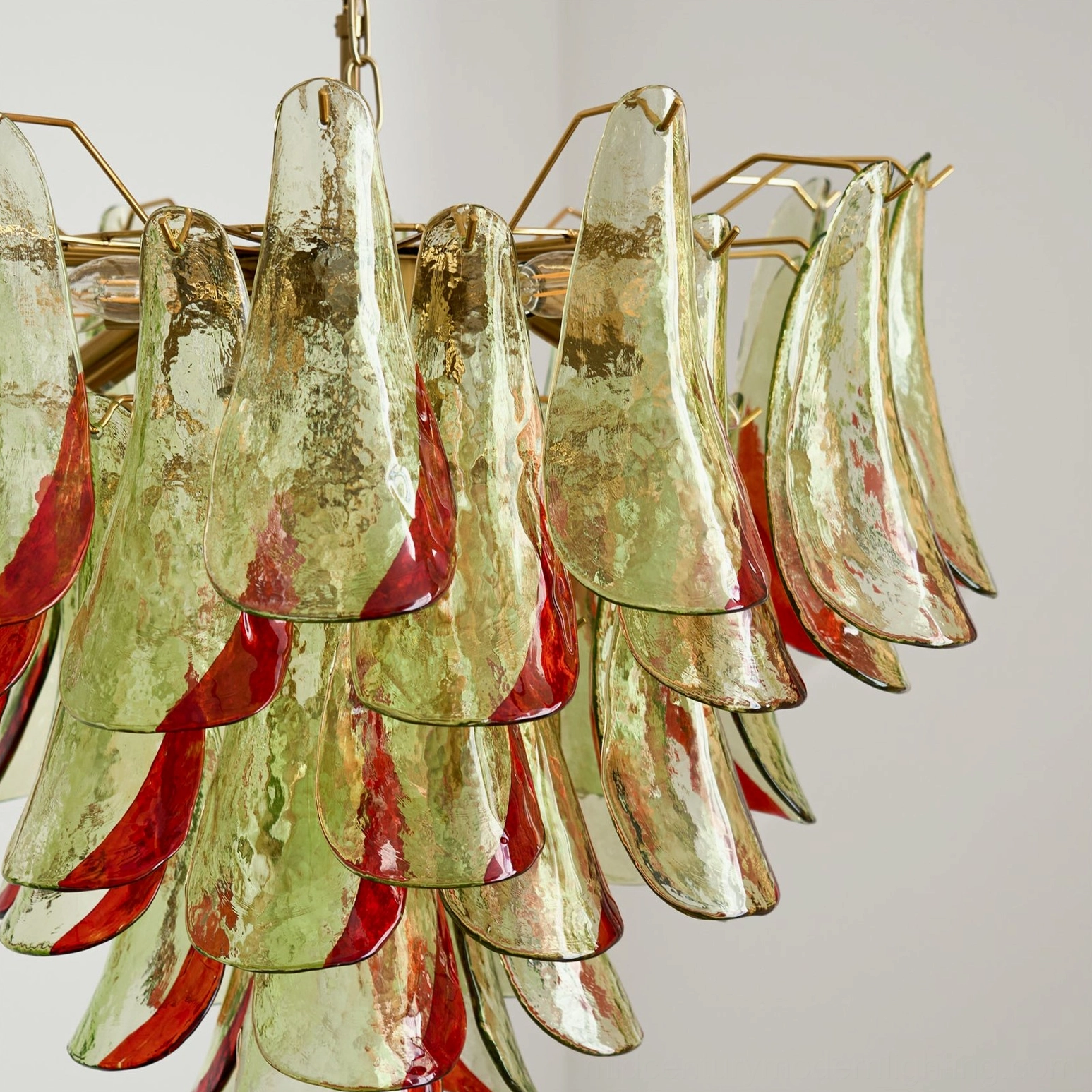 Marielle chandelier studio shot emphasizing organic leaf-like glass petal design and metal structure