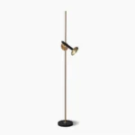 Marquina black marble floor lamp with brass spotlight head and black metal pole, front view on white background