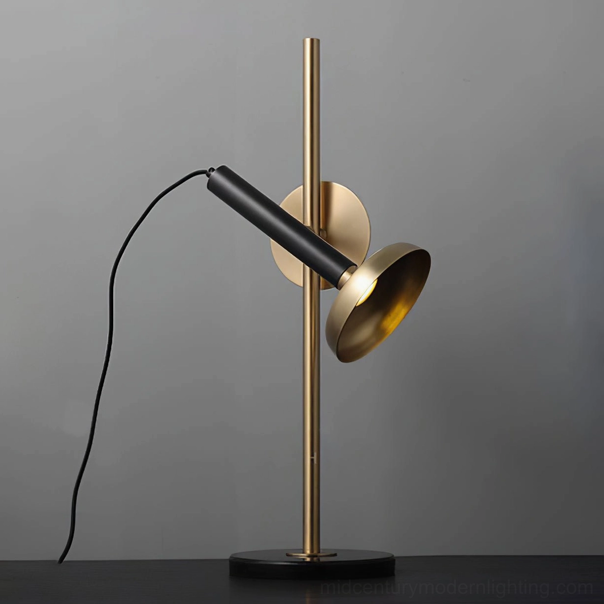 Marquina black metal and brass table lamp - side low angle studio view with cord
