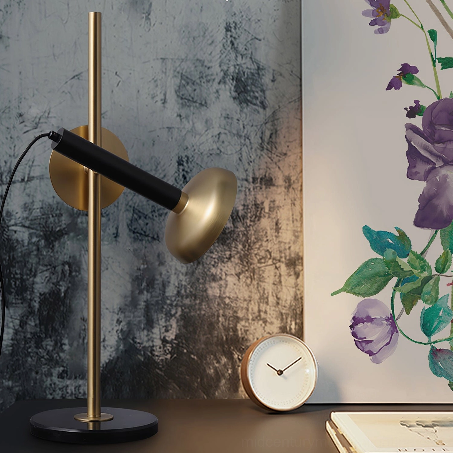 Marquina brass and black metal lamp beside home decor accessories - styled tabletop scene