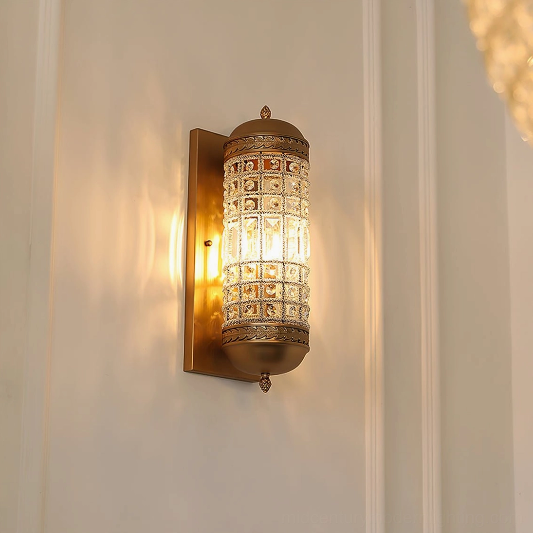 Three-quarter view of lit marrakech wall sconce with ornate metal trim and glowing bulb