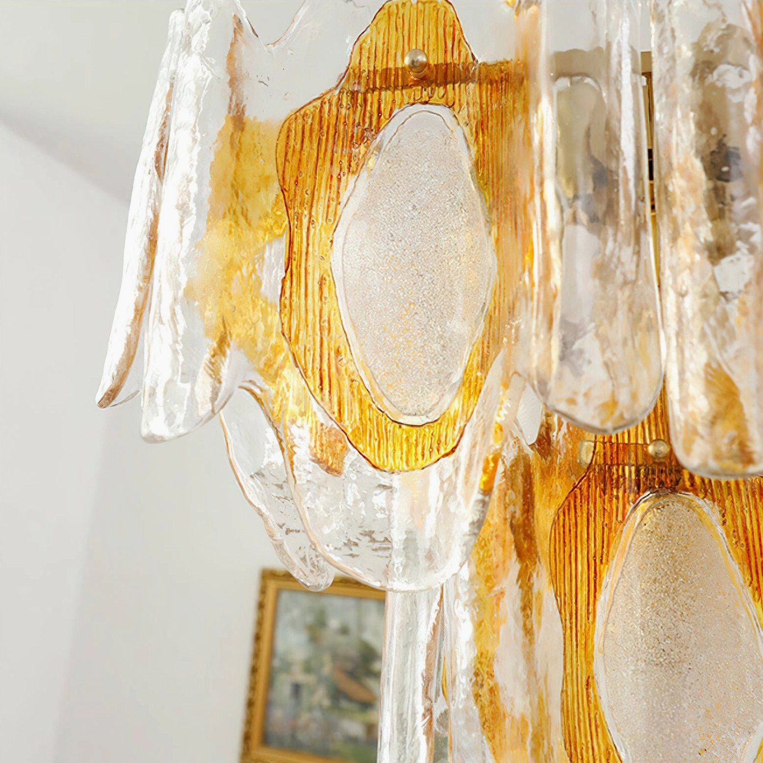 Marrina glass chandelier showing suspension rod and architectural ceiling mounting with clean modernist line design