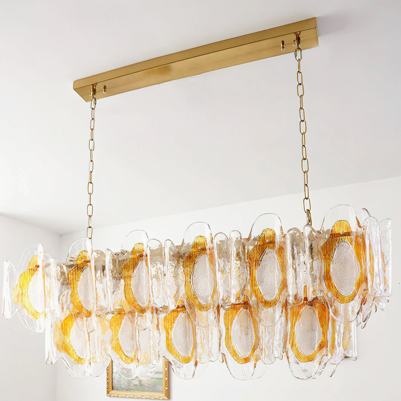 Marrina chandelier artistic detail showing light refraction through amber and clear sculpted glass petals creating luminous effects
