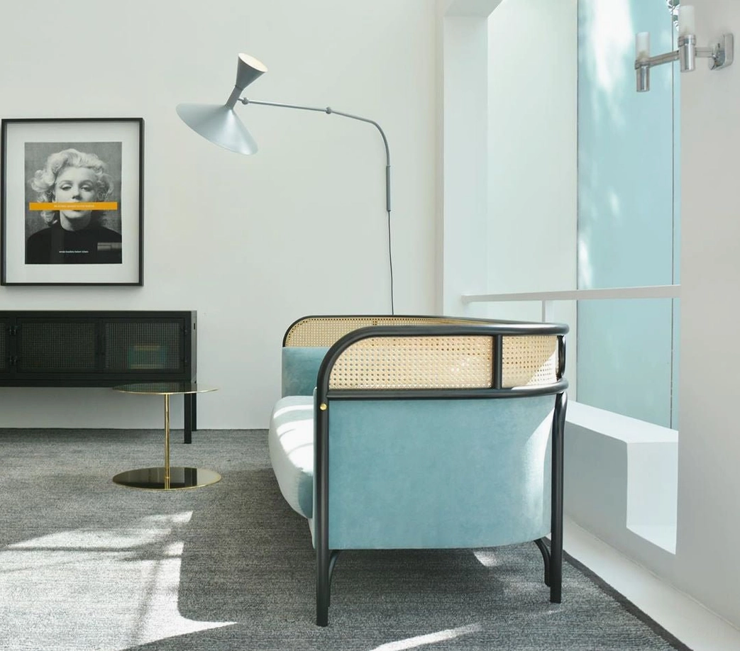 Marseille grey swing arm metal lamp in modern lounge area with glass partition