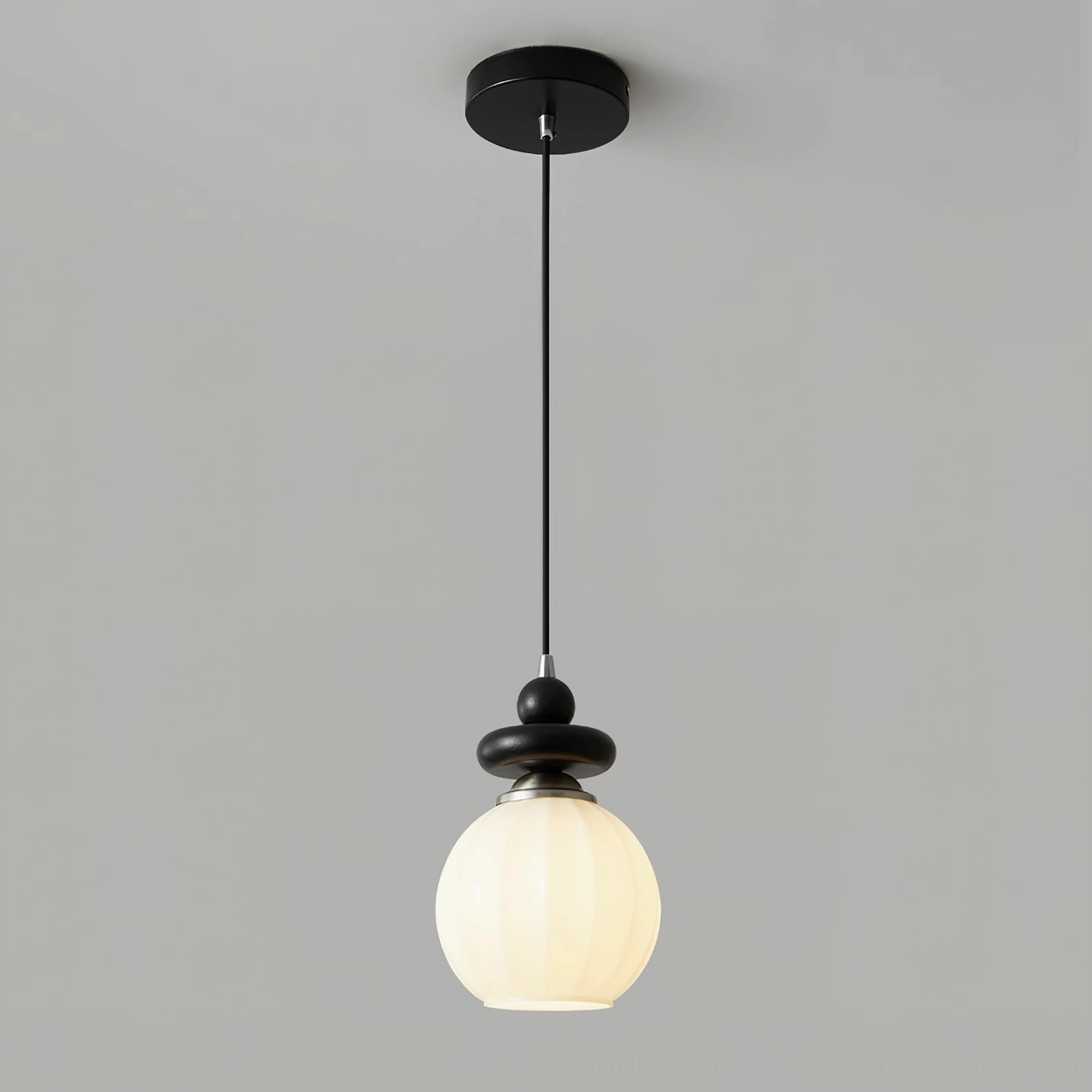 Maru single light Model A pendant - 5.9 inch diameter ribbed glass globe with black metal frame for ambient bedroom lighting