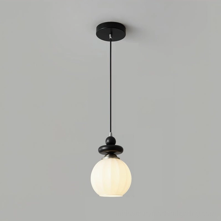 Maru pendant light installation showcasing the fixture's warm light distribution and mid-century aesthetic in home interior setting