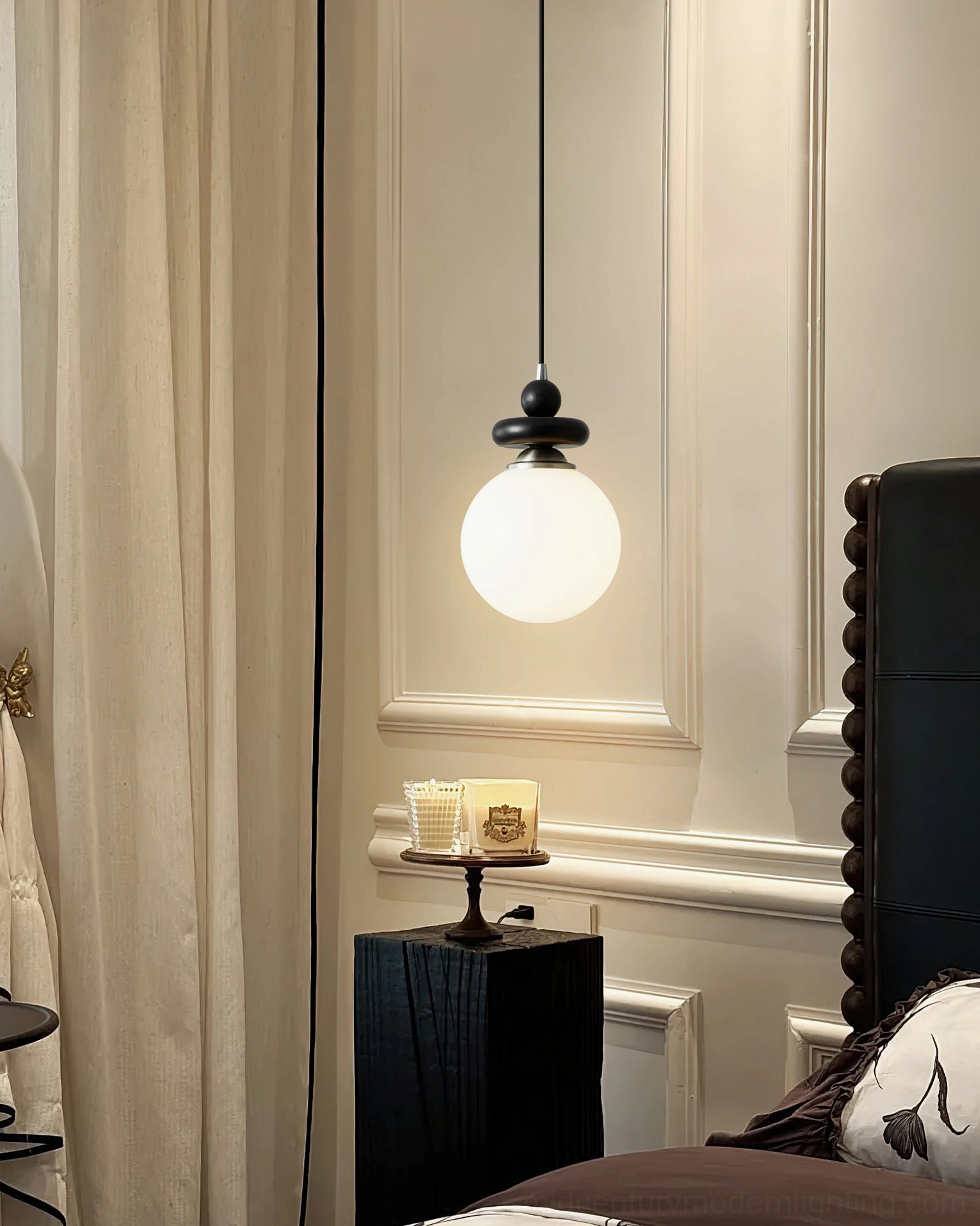 Maru single globe pendant light in classic paneled bedroom corner with consistent mid-century modern design and warm glow