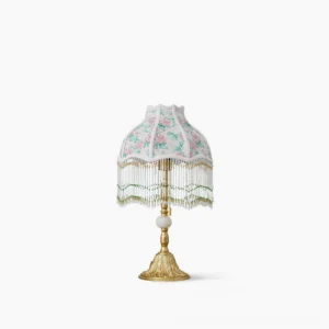Masa beaded floral table lamp front view with ornate gold carved metal base and pink rose fabric shade with green tassel fringe