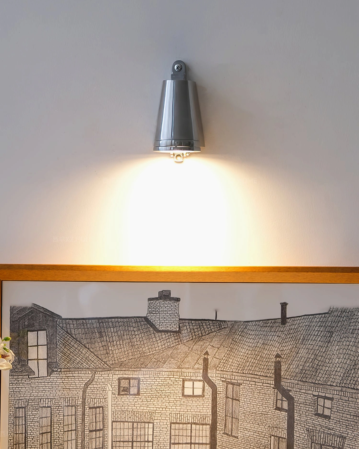 Mast silver wall spotlight creating architectural accent lighting in contemporary room