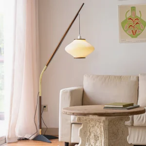 Matsusu floor lamp in cozy living room setting with warm lighting, sofa and carved wooden side table
