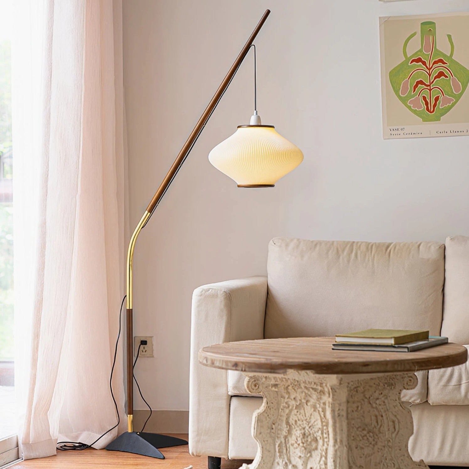 Matsusu floor lamp in cozy living room setting with warm lighting, sofa and carved wooden side table