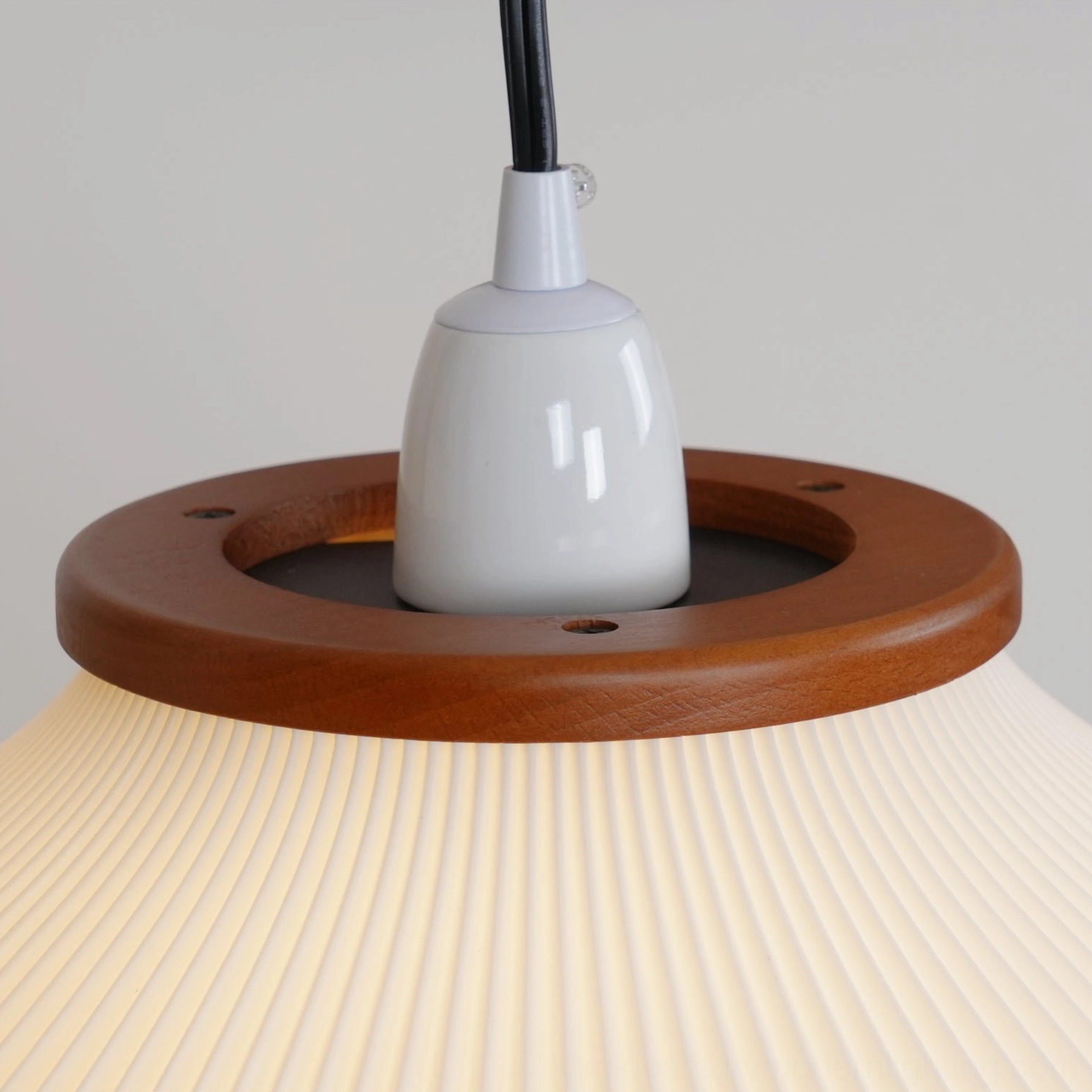 Matsusu arc floor lamp wooden arm curve and metal bracket assembly architectural detail