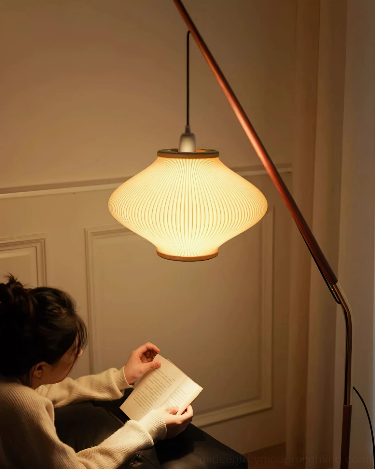 Matsusu arc floor lamp positioned in corner creating ambient atmospheric lighting effect