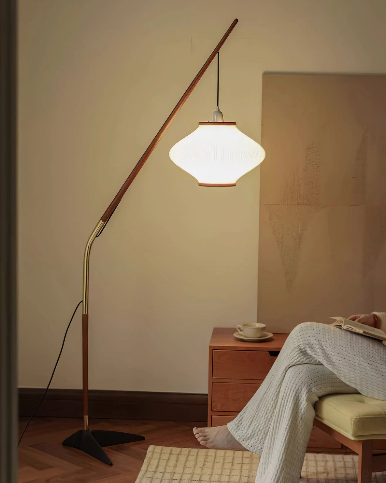 Matsusu floor lamp base showing triangular metal design stability and architectural balance