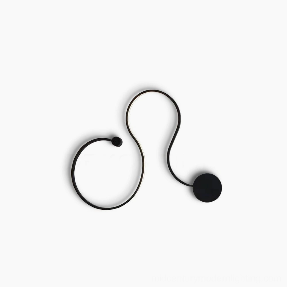 Matte black sculptural snake wall sconce with organic curved form on white background